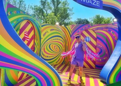 Festival-goers explore the Candy Crush Maze at Mighty Hoopla Festival in Brockwell Park, London