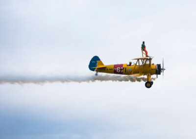 Save the Children Jumping Jumpers Wing Walker on a yellow bi-plane - TOMO Events